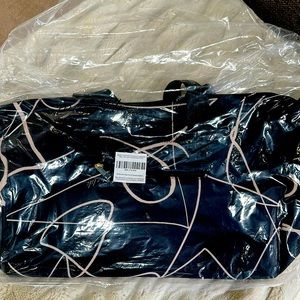 NWT Mali and Lili weekender bag still in original packaging. Black and tan